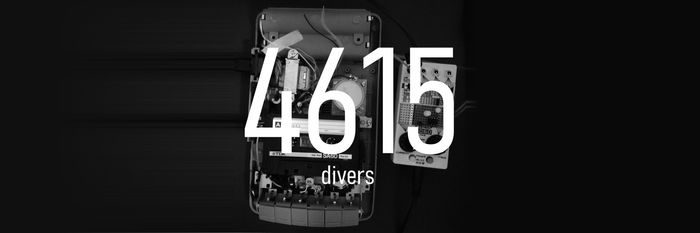 White text reading "4615 divers" on a black and white photo of a tape recorder and electrnic components