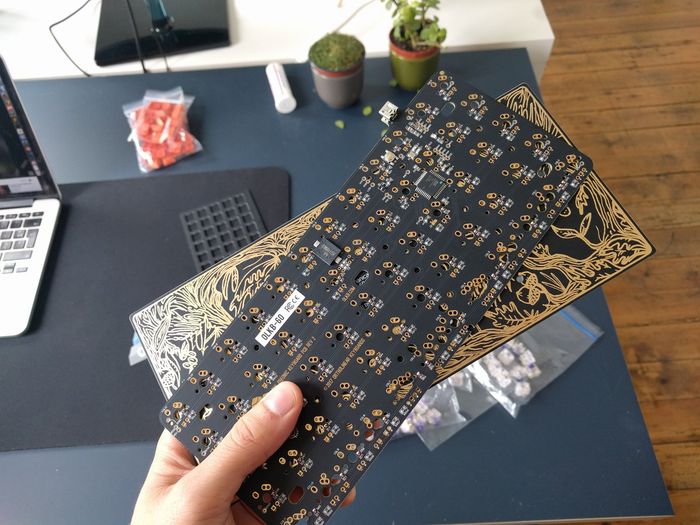 Two PCBs with gold wiring and black solder mask