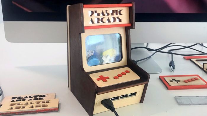 A miniature arcade cabinet made of lasercut wood panels